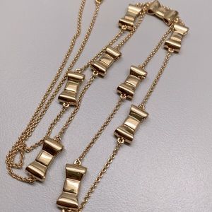 Kate Spade gold colored bow necklace